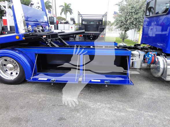 Peterbilt 337 truck side view showing open toolbox compartment and blue paint.