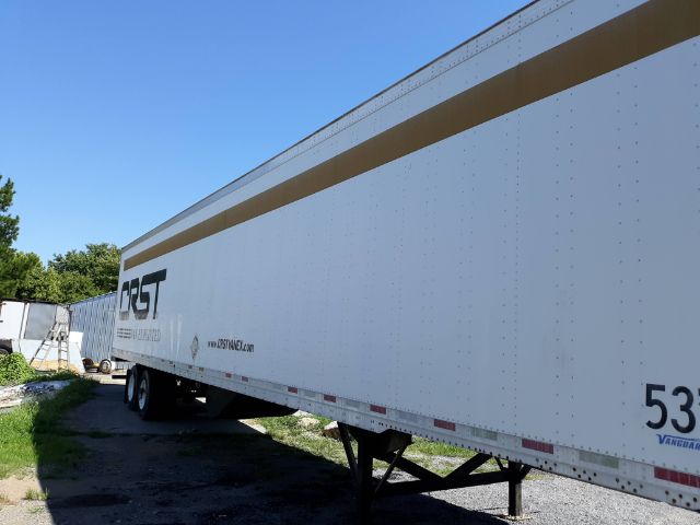 Utility trailer side view showing CRST logo and tan stripe with wheel set and landing legs.