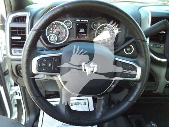 Ram steering wheel and dashboard in a 2023 Ram 4500 SLT showing instrument cluster and steering wheel controls.