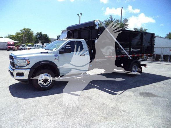 2024 Ram 5500 HD SLT truck in a lot with refuse body, side profile view, white cab and black dump bed.
