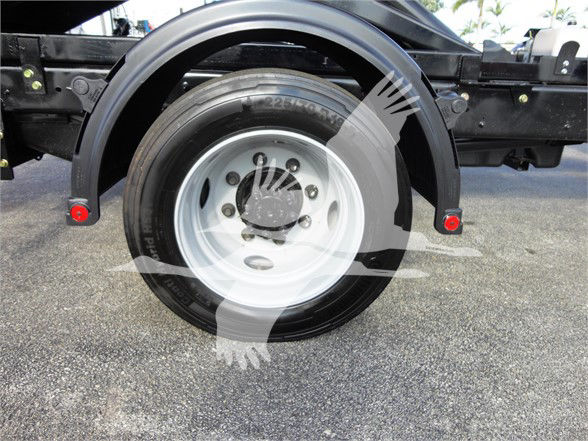 Truck rear wheel and fender showing spare tire and hub on Chevrolet Silverado 5500HD chassis.