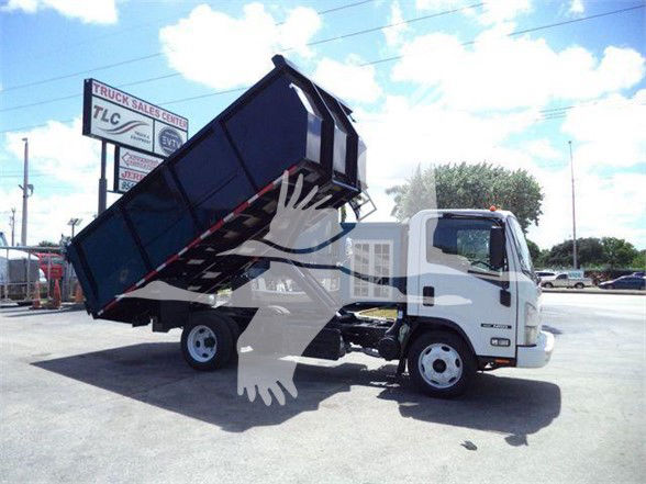 Isuzu NRR dump truck with bed raised, side view showing front cab and hydraulic tilt mechanism.