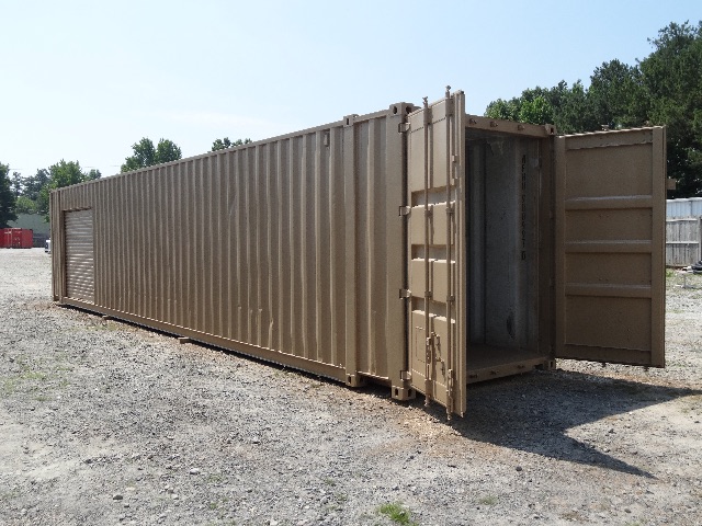 A long brownish 40-foot shipping container on a gravel lot with doors open at one end.