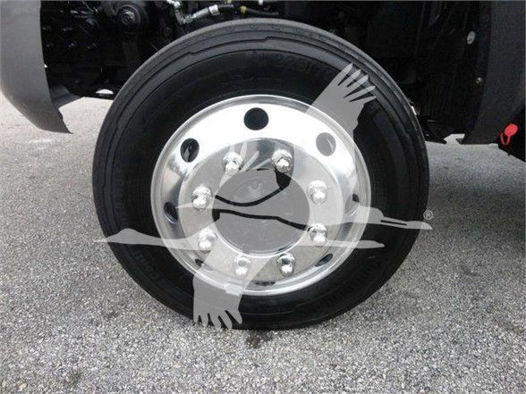 Truck wheel with a silver hub and black tire; no legible labels visible on the image.
