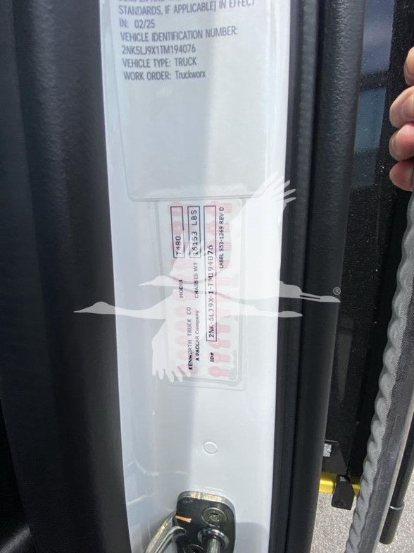 Kenworth T480 door jamb/label area showing vehicle VIN sticker and weight tag with numbers.