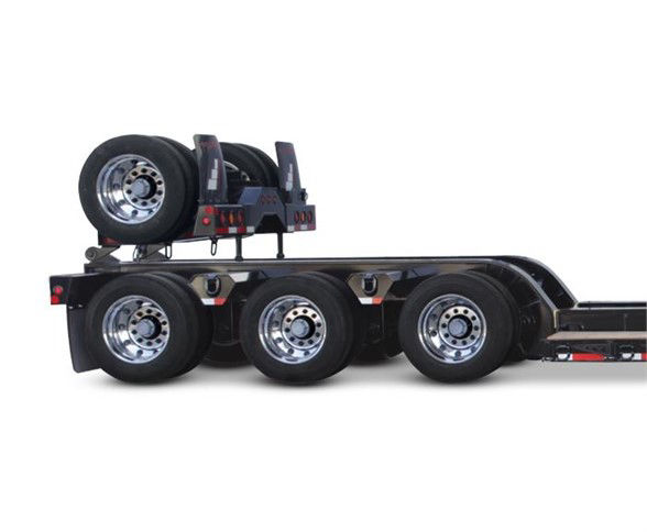 Fontaine 4th axle flip lowboy trailer showing three axles and mounted spare wheel.