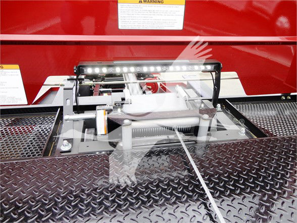 Trucks equipment showing a hydraulic landing gear mechanism with a bright LED light bar mounted above, on a diamond-plate platform.