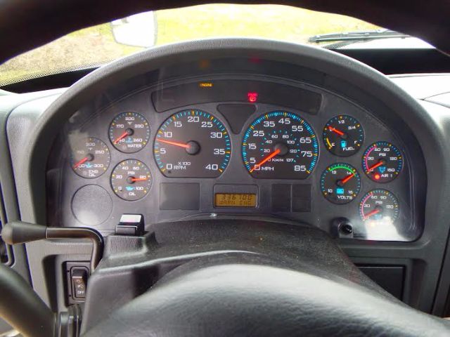 Dashboard view of a International 8600 truck showing multiple gauges including RPM, speedometer, fuel, and warning lights.