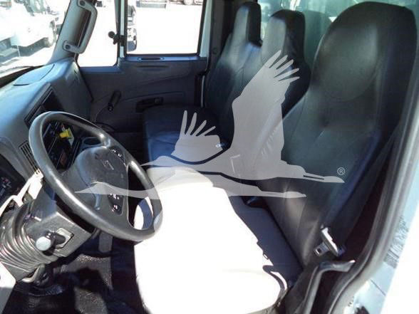 Interior of a 2019 International DURASTAR 4300 truck cab with steering wheel, driver seat, and front bench seating visible.
