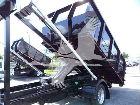 Ram 5500 dump truck bed with hydraulic lift and black dump box on a chassis.
