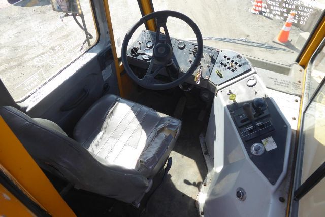 Kalmar 4x2 yard truck cab interior showing steering wheel and control panel with seat.