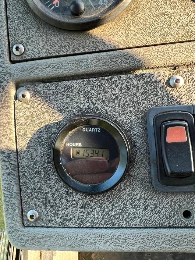 Hours quartz gauge showing 15341 on the meter panel with switch nearby.