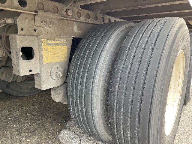 Trailer axle and dual tires of a 2015 Wabash 53' dry van showing wheel, suspension, and frame components.