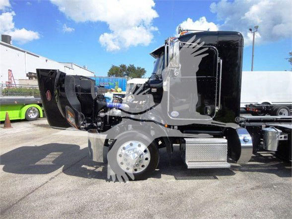 2022 Peterbilt 337 side view with hood open showing front wheel, chrome fuel tanks, and cab. Visible are no readable labels on the image itself.
