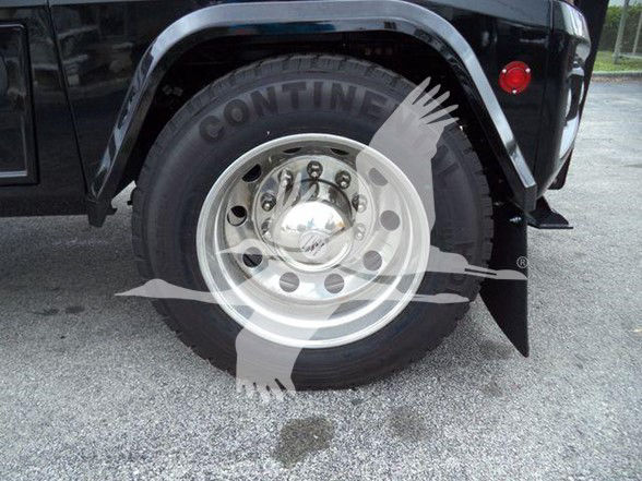 Freightliner M2 106 wheel and fender showing Continental tire and polished steel wheel.