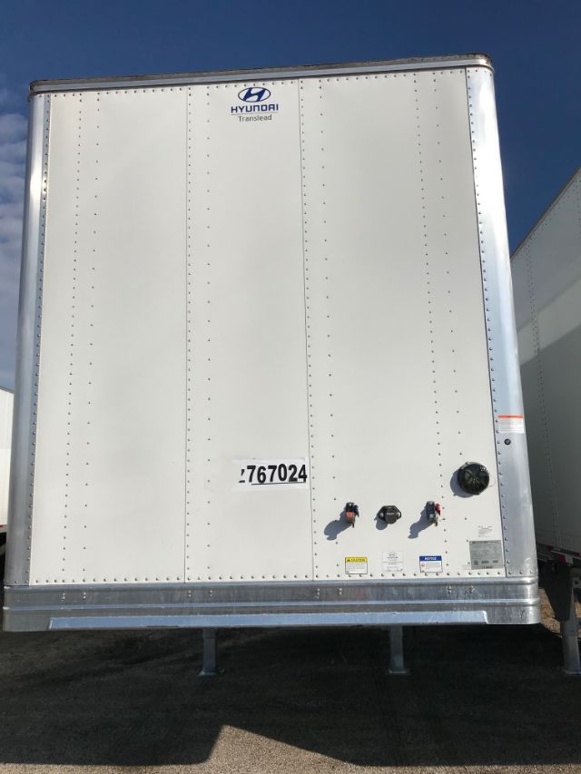 Hyundai Translead trailer rear with stamped number 767024, logo near top, and control valves along lower right panel.