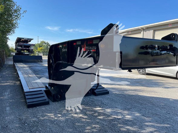 XL Specialized Mini Deck trailer with black flatbed sections, hydraulic ramps extended, and 'SPECIALIZED' branding on the side.