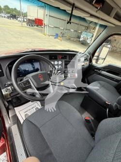 Kenworth T880 truck interior dashboard and steering wheel view with seating and controls.
