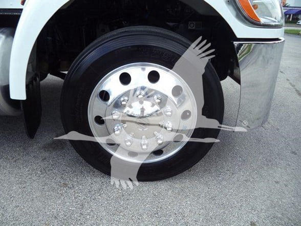 Peterbilt 337 wheel/rim close-up showing polished hub and lug nuts.