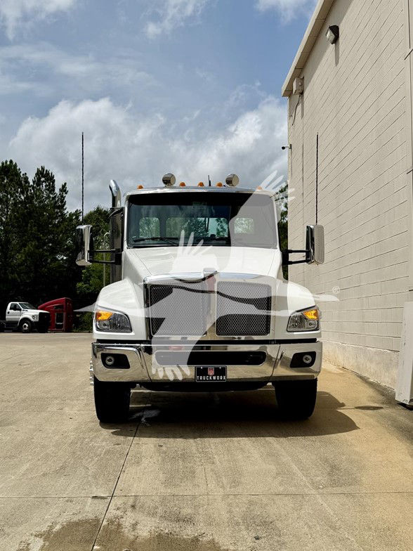 Kenworth T480 cab chassis front view in white with chrome bumper and large grille, dual mirrors, and clearance lights on roof.