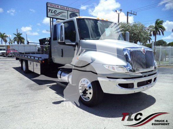 Truck chassis showing 2022 International MV with flatbed, chrome grille, and cab mirrors.
