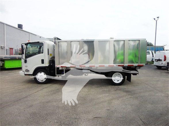 Isuzu NQR dump truck side view with white cab and silver dump body, no visible branding on side.