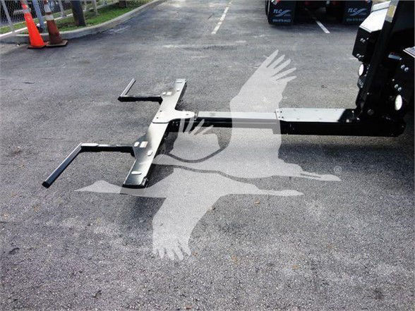 Ram 5500 tow truck with heavy duty hitch attachment on pavement