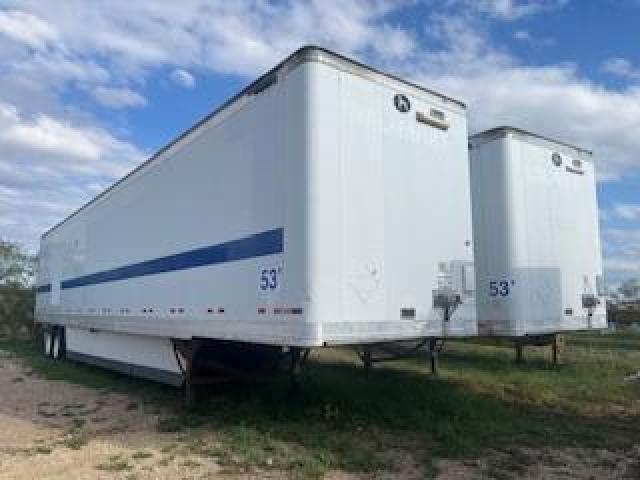 Great Dane 53x102 dry van trailer pair, white with blue stripe, 53 ft length, dual-tandem axles, parked on grass.