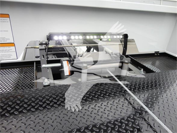 Ram 5500 HD SLT tow truck setup showing a mounted LED light bar and hydraulic winch on a diamond plate bed.