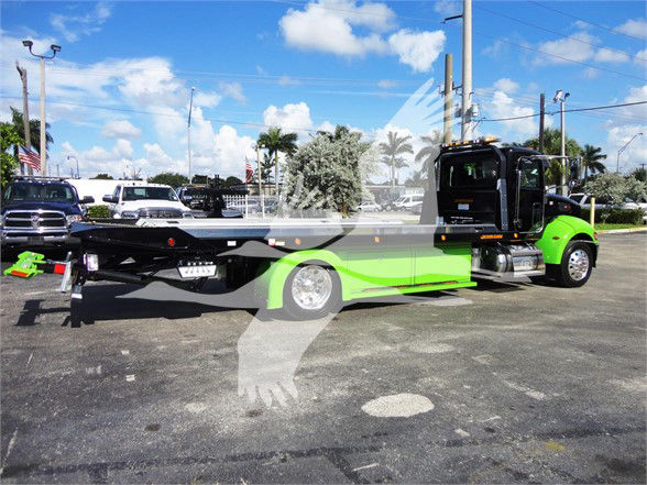 2022 Peterbilt 337 tow truck side view with bright green and black color scheme, stock number J56607.
