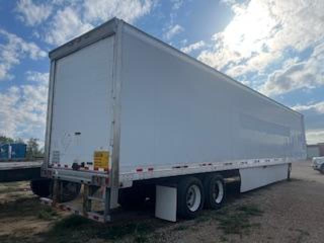 Great Dane 53x102 dry van trailer showing plain white exterior, tandem axles, rear doors, and reflective tape along side.