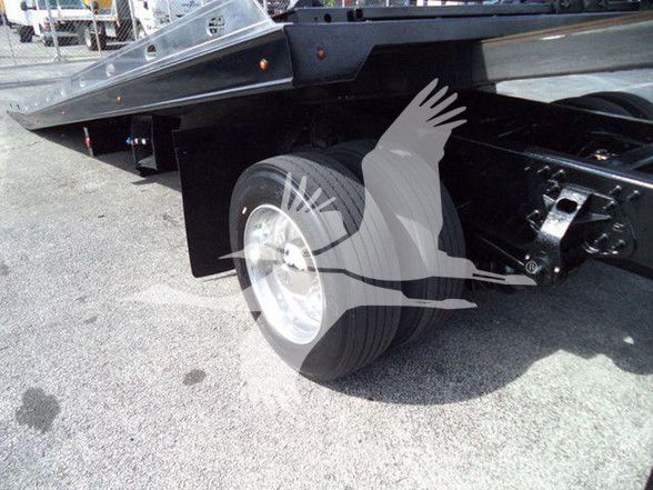 Hino 258ALP truck rear wheel and flatbed section showing wheel, suspension, and frame.