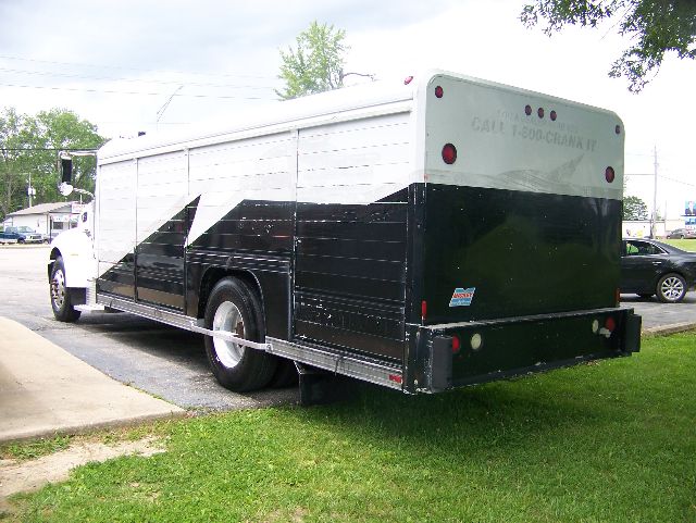 Peterbilt 335 box truck rear view showing large cargo box and dual rear lights.