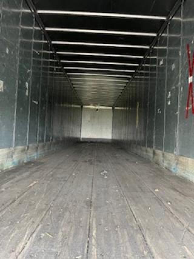 Interior of a 2008 Great Dane 53x102 dry van trailer showing wooden floor and metal walls.