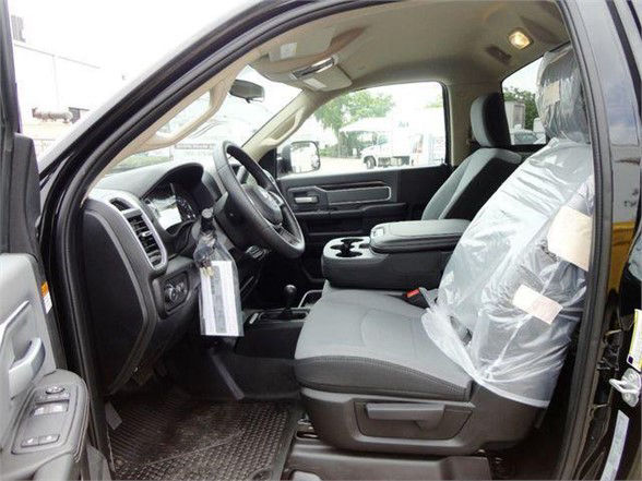 Ram 4500 SLT interior showing front seats and driver area with plastic-wrapped passenger seat.
