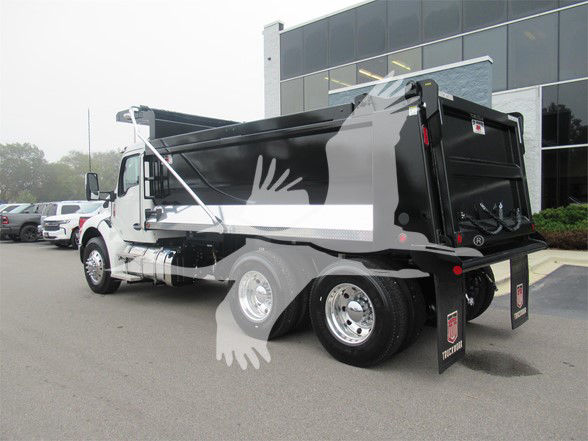 Kenworth T480 dump truck side and rear view with dump bed and dual rear axles.
