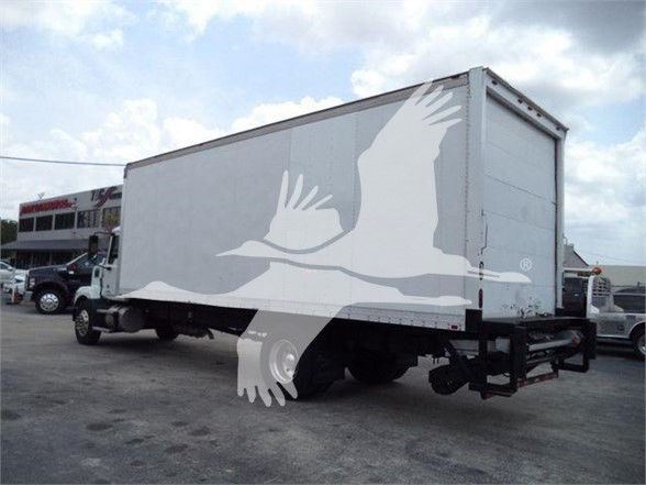 Box truck trailer with white exterior and a large gray silhouette watermark of a bird in flight. No legible labels visible on the trailer side.