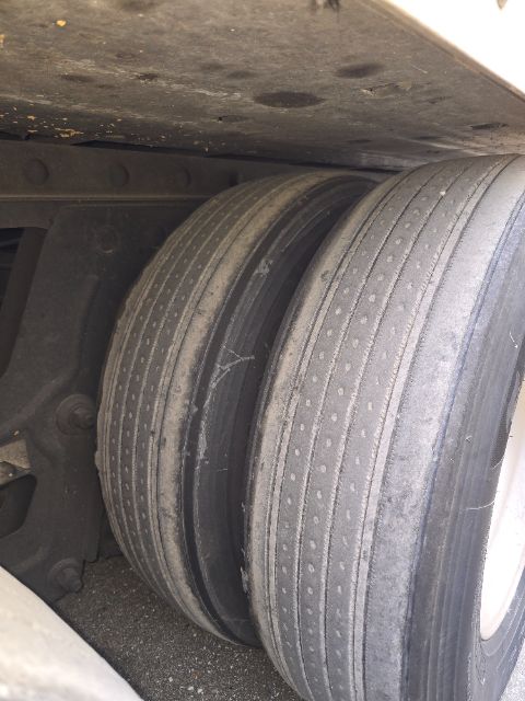 Great Dane trailer suspension showing dual/paired air springs or tires with ribbed tread surface visible.