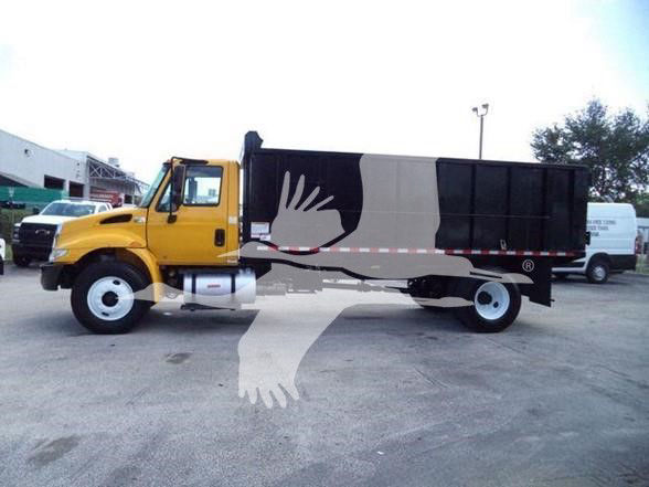 Truck side view with yellow cab and black dump bed showing VIN and stock details on listing page text.