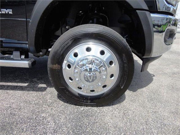 Ram 5500 SLT wheel and chrome hubcap with black tire, front fender and side step visible