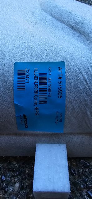 Blue tag label on Volvo 760 truck part showing part number and bar code with text HERC HCR? and weights.
