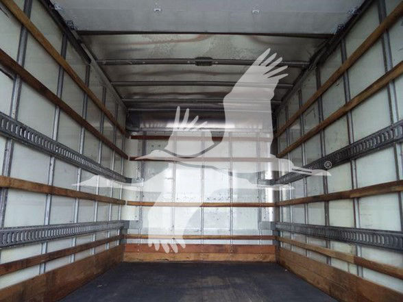 Isuzu NPR HD truck cargo area interior with side rails and empty box.
