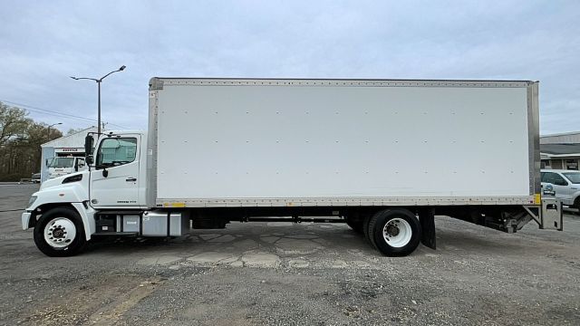 Box truck side view showing 2017 Hino 268 with a large rectangular cargo box and white cab.