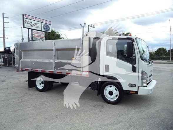 Chevrolet W4500 dumped truck with a silver bed, front cab, and white wheels parked on lot.