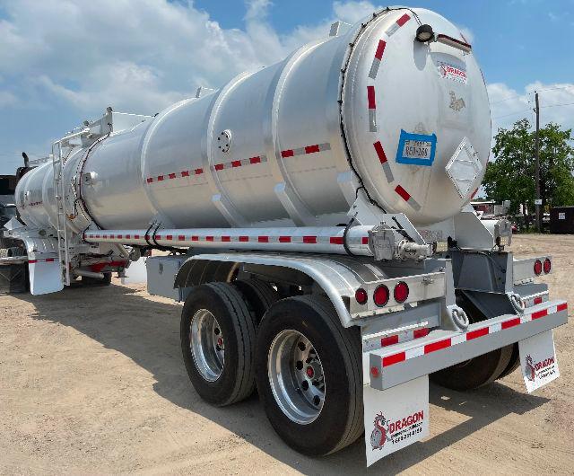 Crude oil tank trailer 2012 Dragon 200BBL aluminum DOT407 cylindrical tanker with rear view showing wheels, labeling, and safety decals.