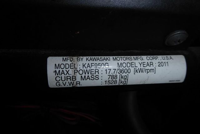 Label on Kawasaki KAF950G showing model KA F950G, model year 2011, max power 17.7/3600 kW/rpm, curb mass 788 kg, GVWR 1528 kg, manufactured by Kawasaki Motors Mfg. Corp., U.S.A.