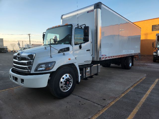 Box truck side view showing 2025 Hino L6 with white cab and aluminum ISO-container box.