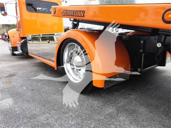 Orange Peterbilt 337 tow truck side view showing front wheel and rear hoist with 'JERR-DAN' branding