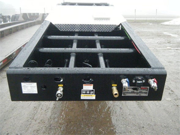 Talbert 55SA Flat Level Deck HRG trailer rear view showing deck grid and hydraulic connections.