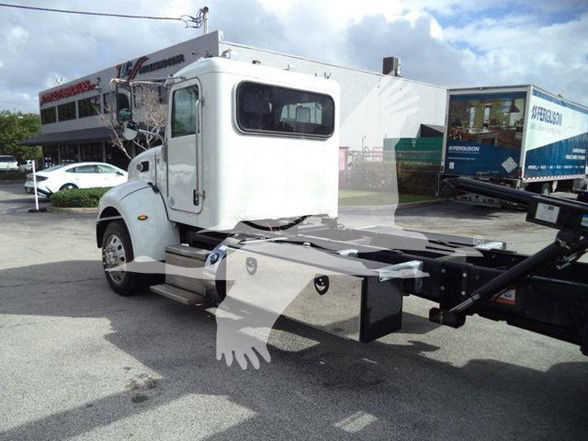 2019 Peterbilt 337 chassis with cab and wheelbase, side view showing cab details and fuel/aluminum toolbox, no cab interior visible.